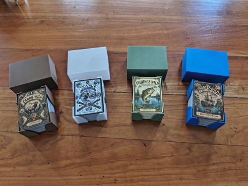 All four Cardswild decks in their color-matched card holders